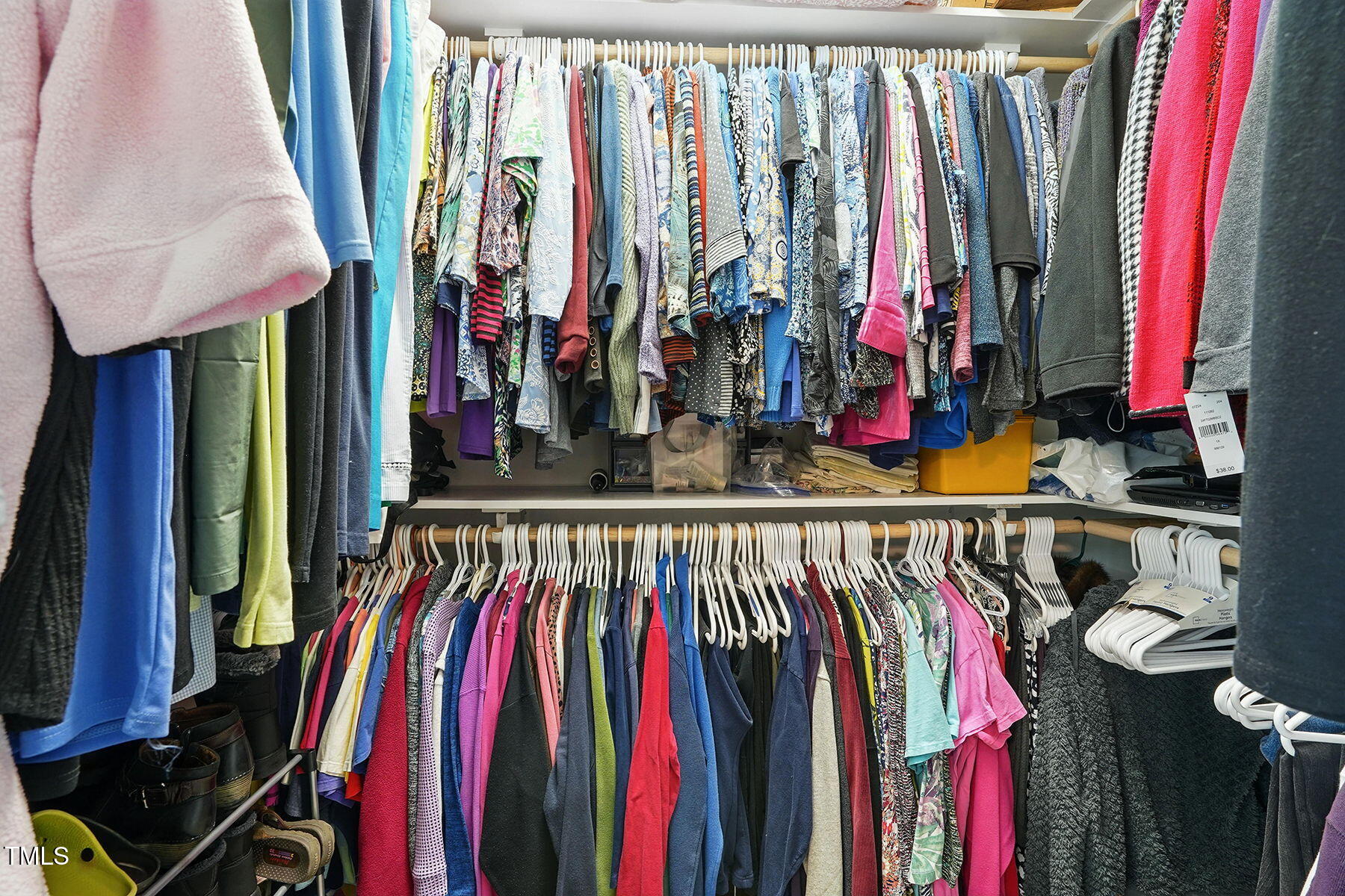 116 Colonade Court Benson, NC 27504 - Photo 19 of 37 a view of walk in closet with clothes