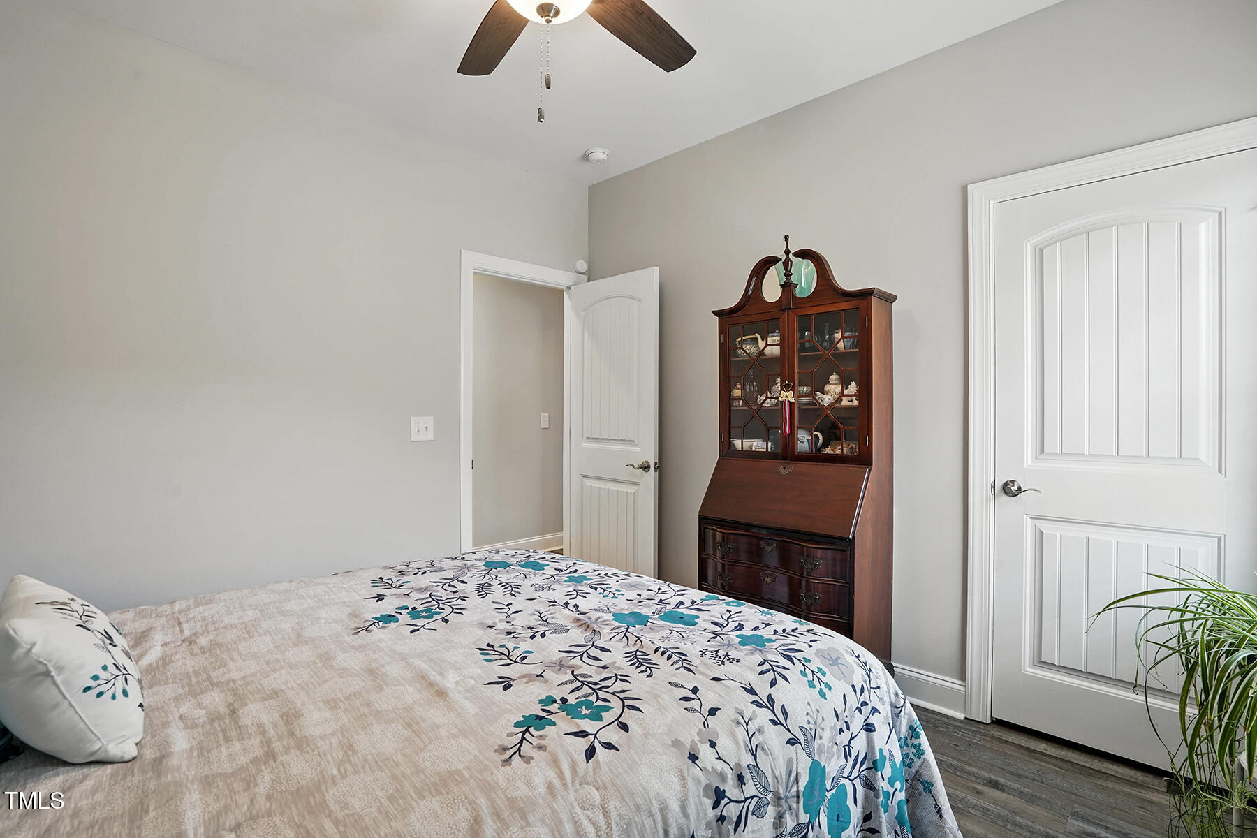 116 Colonade Court Benson, NC 27504 - Photo 23 of 37 a bedroom with a bed and a chandelier