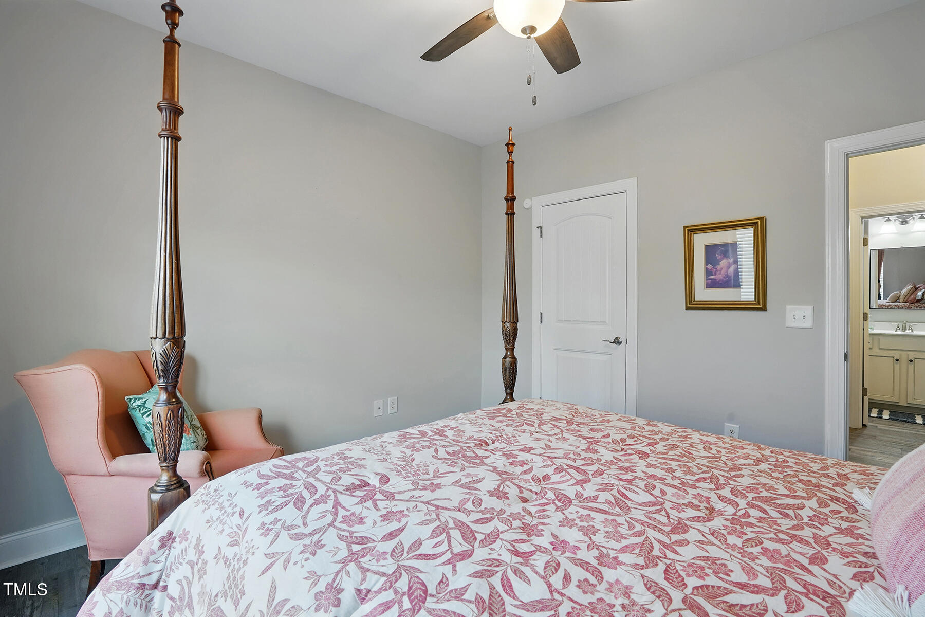 116 Colonade Court Benson, NC 27504 - Photo 26 of 37 a bedroom with a bed and a chandelier