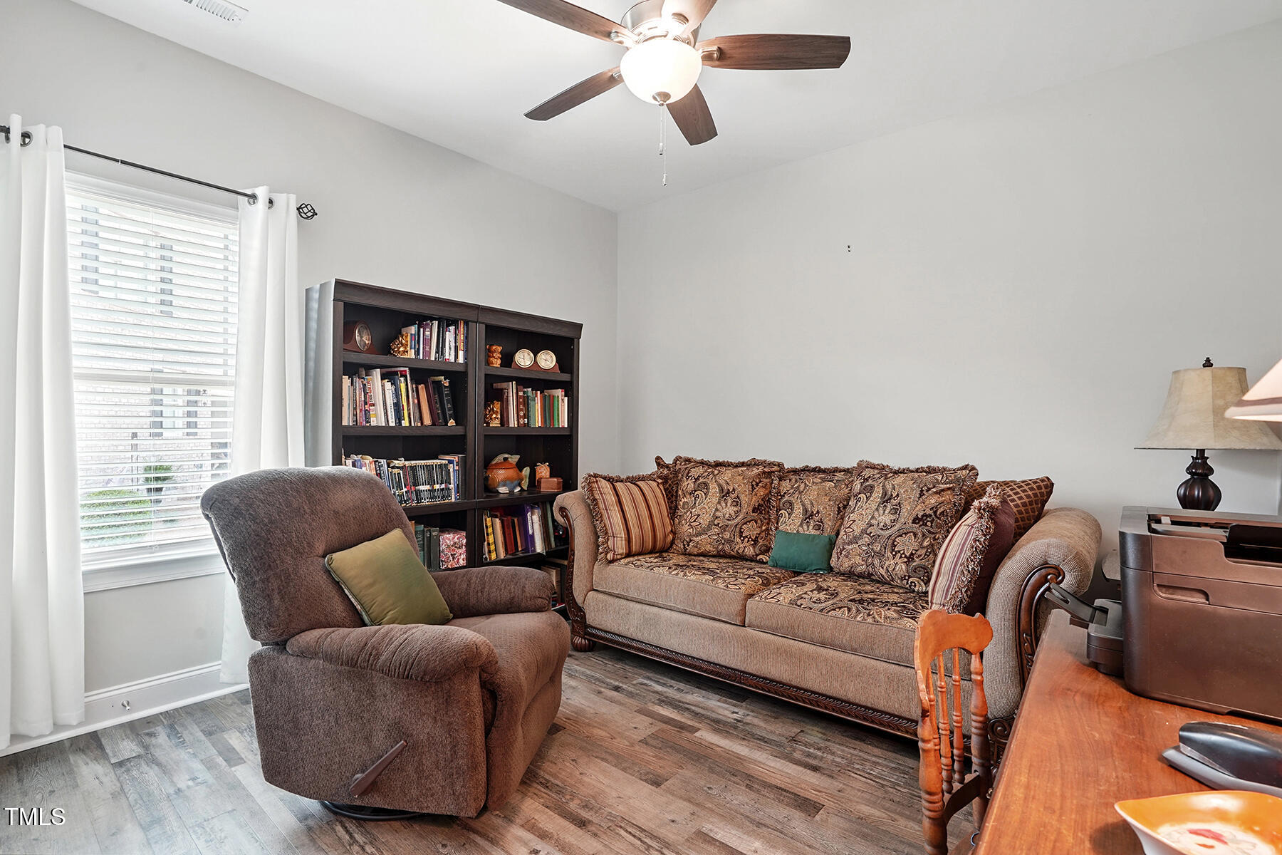 116 Colonade Court Benson, NC 27504 - Photo 27 of 37 a living room with furniture and a large window