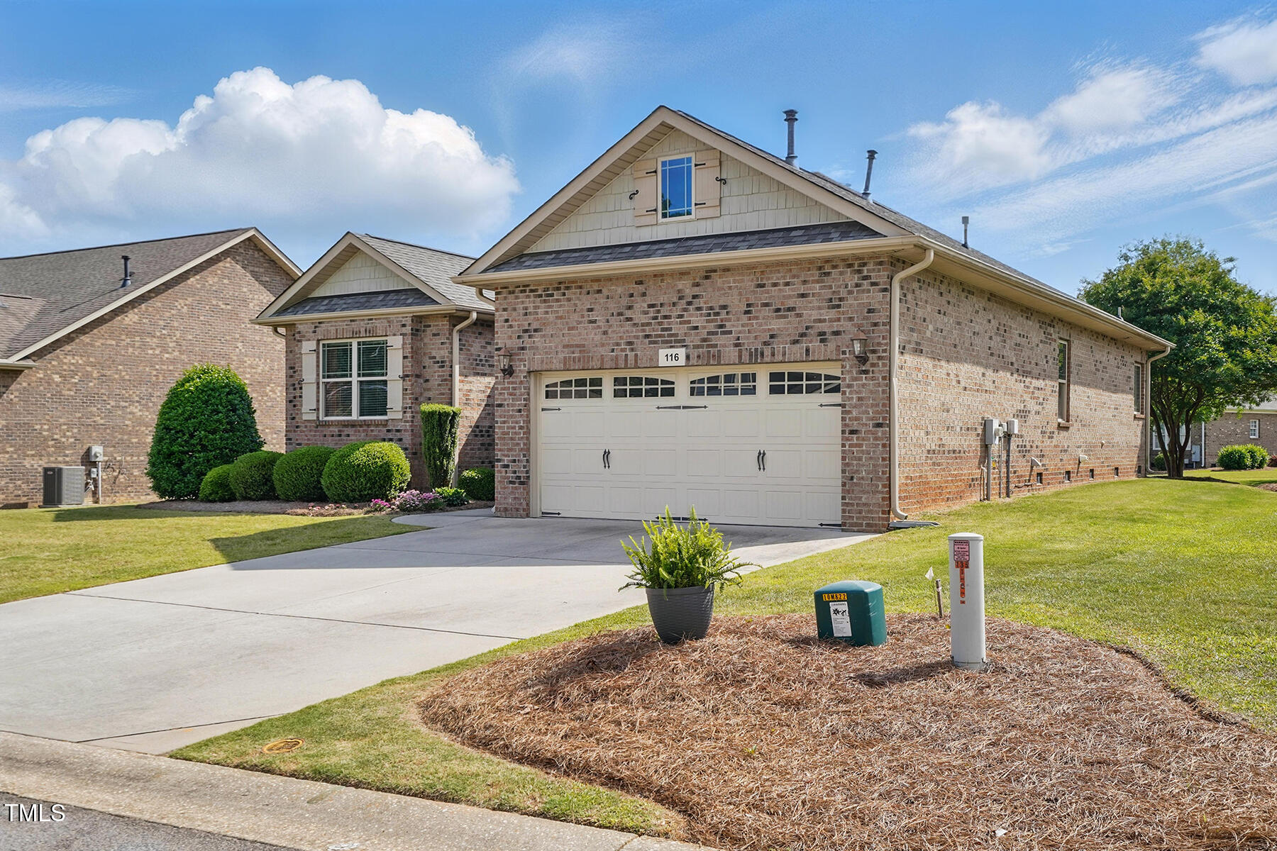 116 Colonade Court Benson, NC 27504 - Photo 3 of 37 a front view of a house with garden