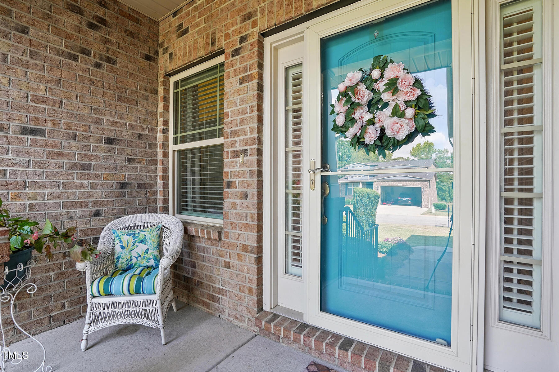 116 Colonade Court Benson, NC 27504 - Photo 6 of 37 a chair with a potted plant on a table