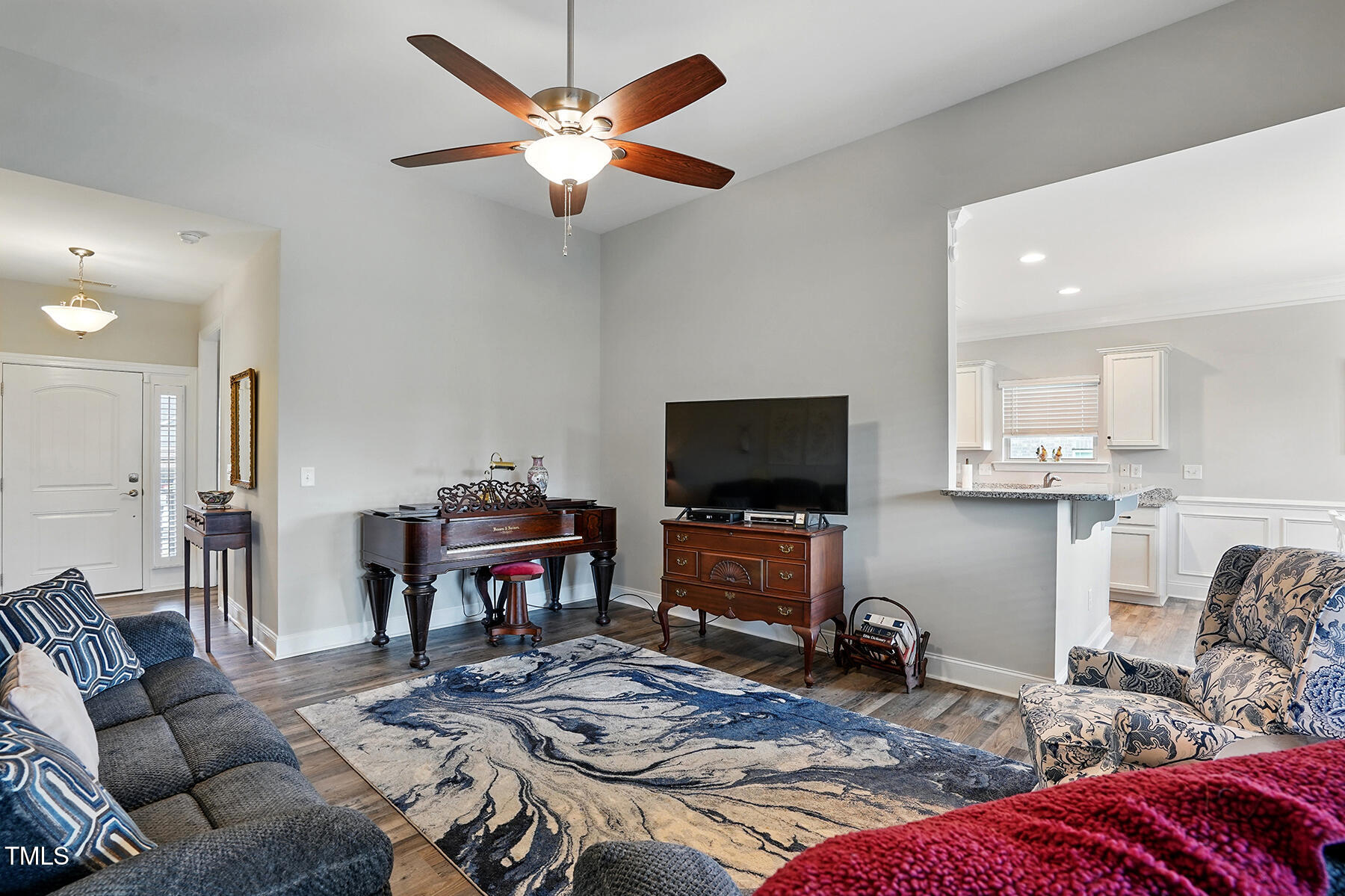116 Colonade Court Benson, NC 27504 - Photo 10 of 37 a living room with furniture and a flat screen tv