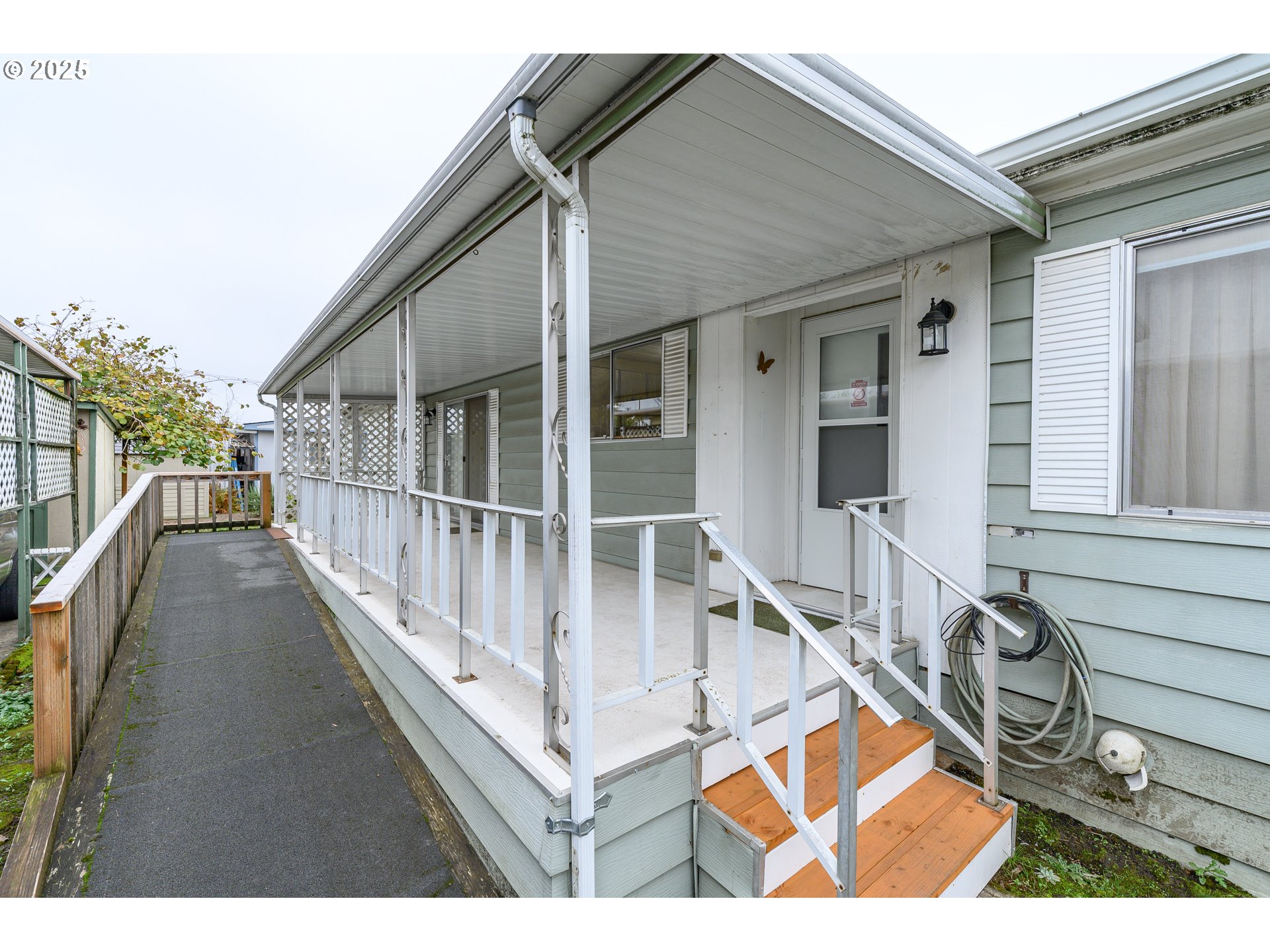 2901 East 2nd Street, Unit 109 Newberg, OR 97132 - Photo 5 of 35 a view of balcony with two large window and dinning table