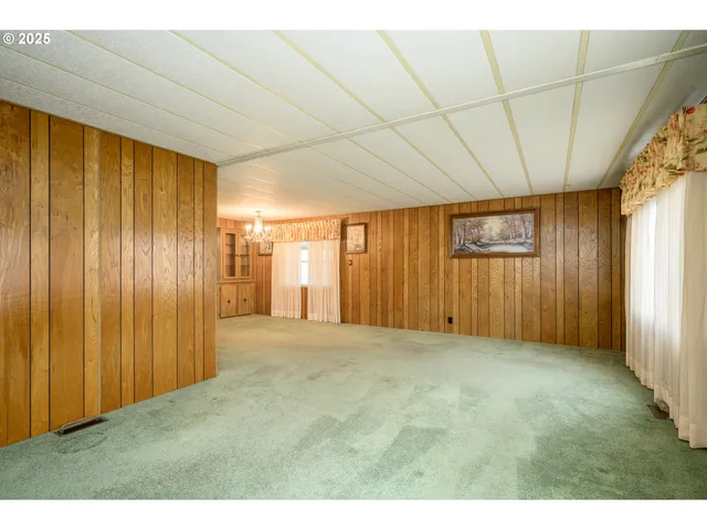 a view of an empty room with windows