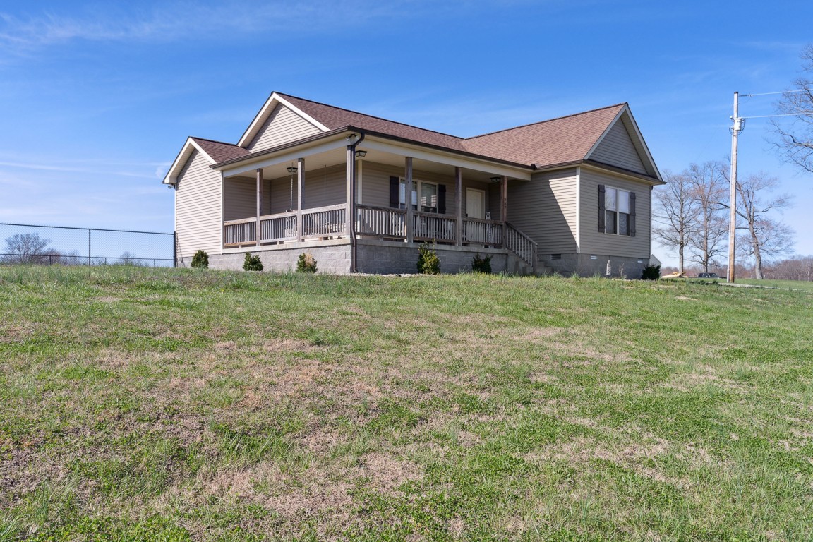 957 Jimtown Road Lafayette, TN 37083 - Photo 2 of 25 a view of a house with a yard