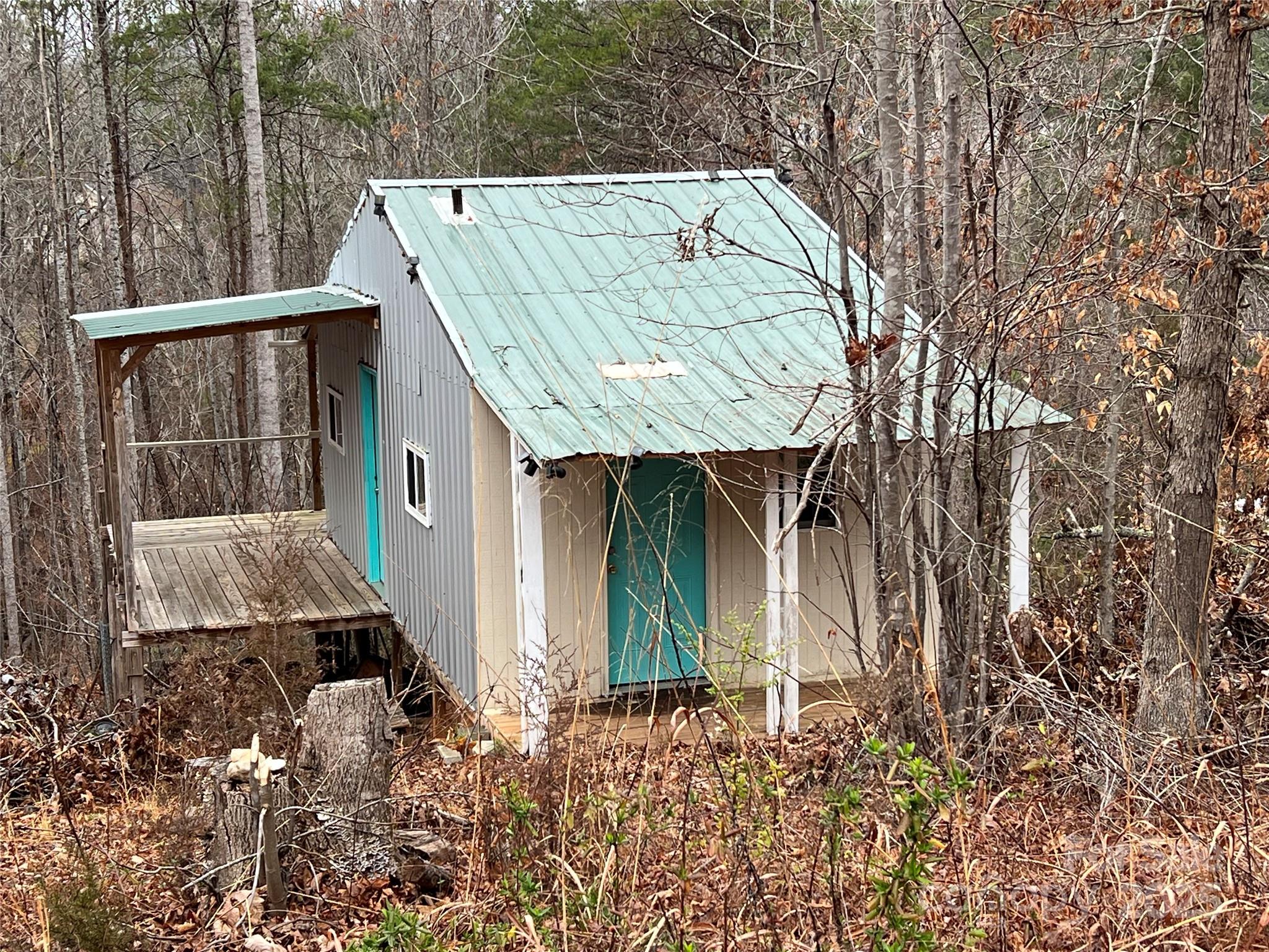 1217 Freeman Road Bostic, NC 28018 - Photo 2 of 16 a backyard of a house with barbeque oven and outdoor seating