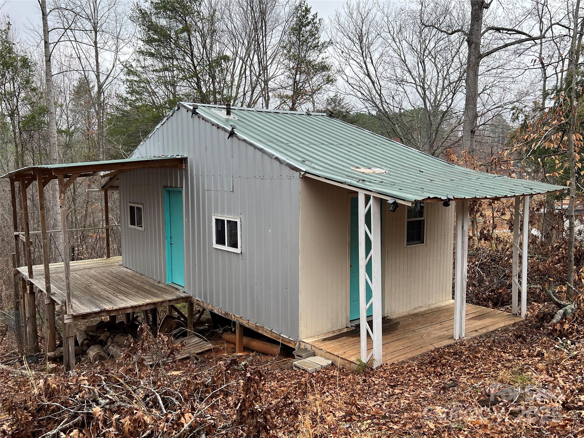 1217 Freeman Road Bostic, NC 28018 - Photo 3 of 16 a backyard of a house with barbeque oven table and chairs