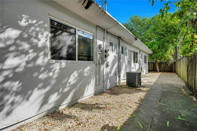 a backyard of a house with seating space