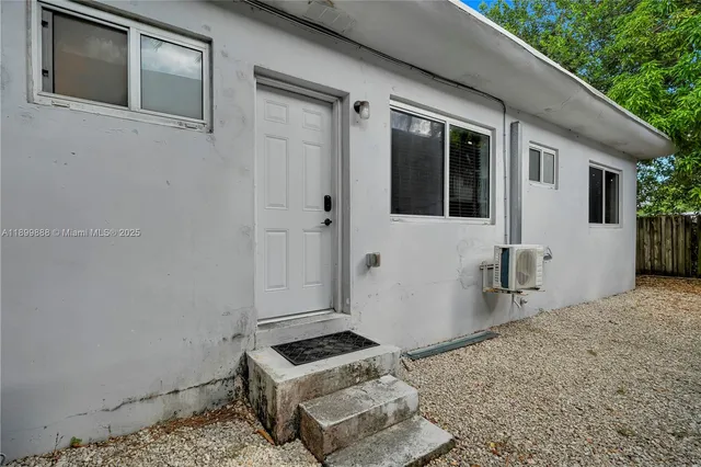 a bedroom with furniture and a flat screen tv
