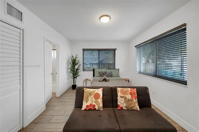 a view of living room with furniture and window