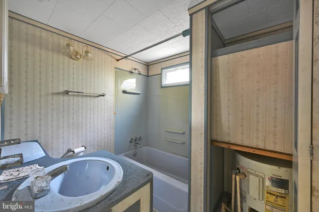 a bathroom with a tub and shower