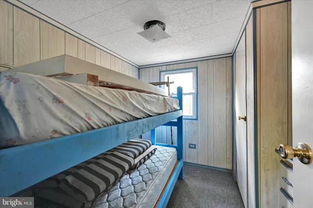 a bedroom with bed and balcony