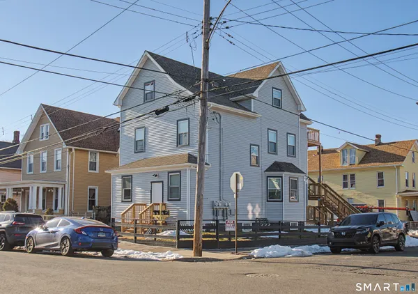 a view of a building and car parked
