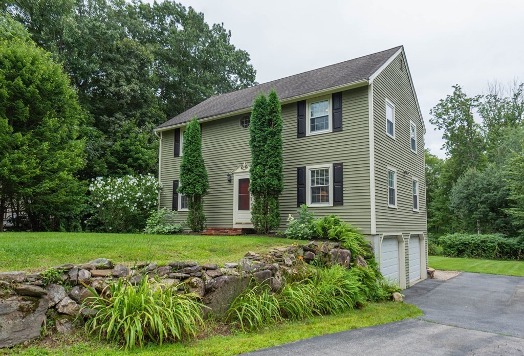 17 Norwood Road Salem, NH 03079 - Photo 1 of 24 a front view of a house with garden