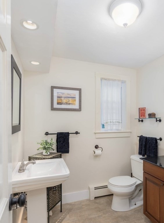 17 Norwood Road Salem, NH 03079 - Photo 14 of 24 a bathroom with a sink a toilet and a mirror