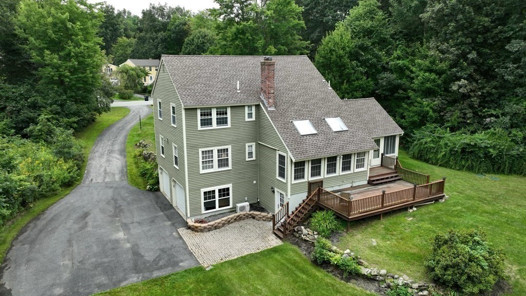 17 Norwood Road Salem, NH 03079 - Photo 23 of 24 an aerial view of a house with a yard table and chairs