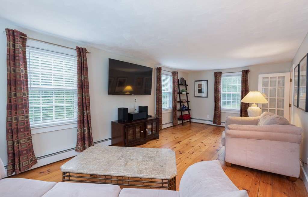 17 Norwood Road Salem, NH 03079 - Photo 9 of 24 a living room with furniture and a flat screen tv