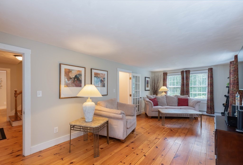 17 Norwood Road Salem, NH 03079 - Photo 10 of 24 a living room with furniture and a wooden floor