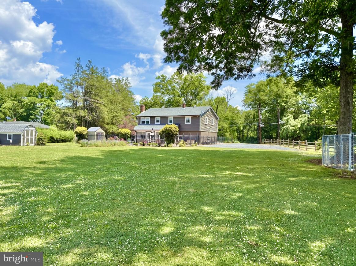 1024 Oxmead Road Eastampton, NJ 08060 - Photo 36 of 39 a front view of a house with garden and trees