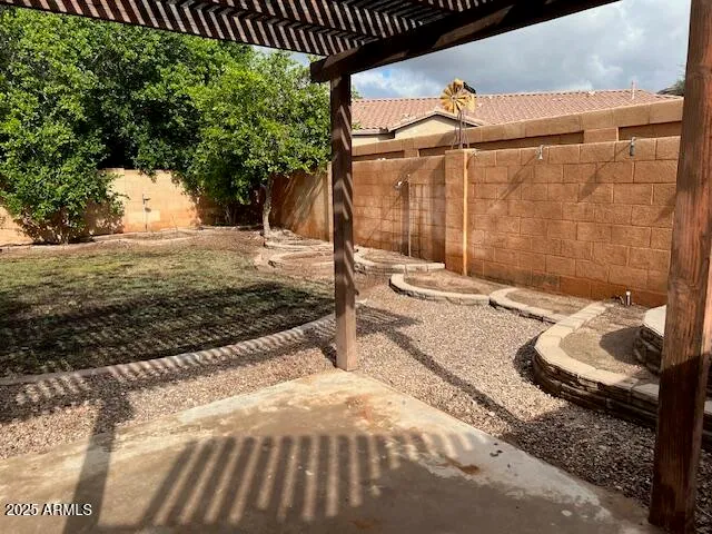 a view of a backyard of the house