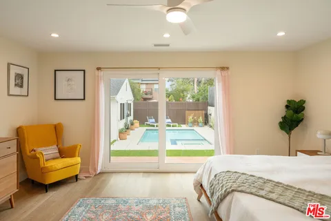 a bedroom with a bed and a couch