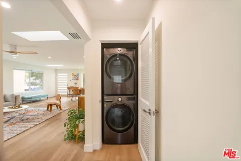 a view of a hallway with washer and dryer