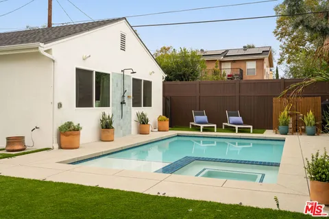 a view of a house with pool table and chairs