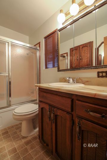 251 West Perdew Avenue Ridgecrest, CA 93555 - Photo 24 of 35 a bathroom with a sink a toilet and mirror
