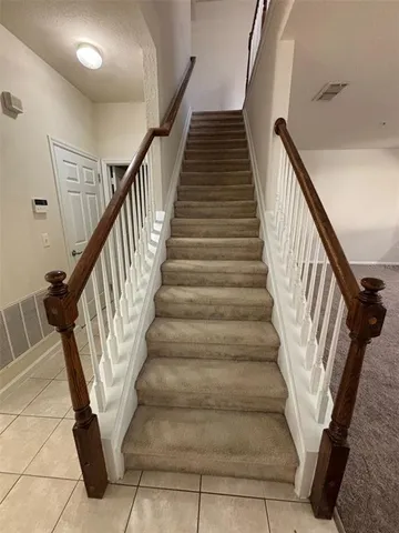 a view of room with furniture and wooden floor