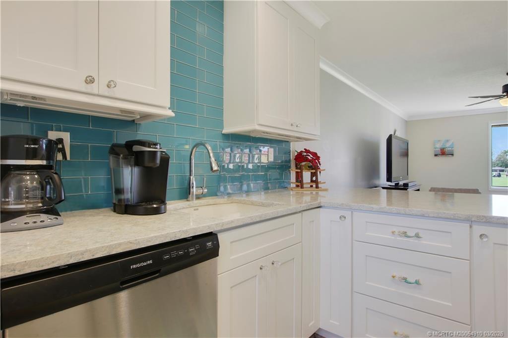 5323 Southeast Miles Grant Road, Unit 206 Stuart, FL 34997 - Photo 5 of 20 a kitchen with sink and cabinets
