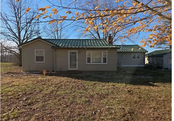 a house with a tree in front of it