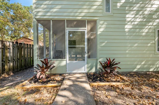a view of a lounge chair in the backyard of the house