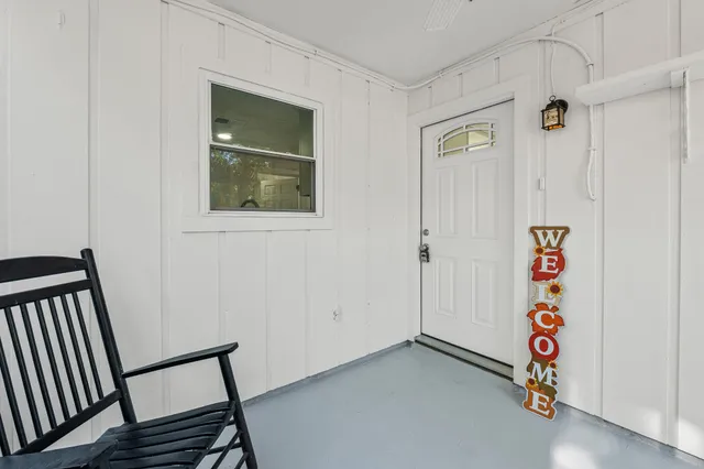 a view of an entryway with wooden floor