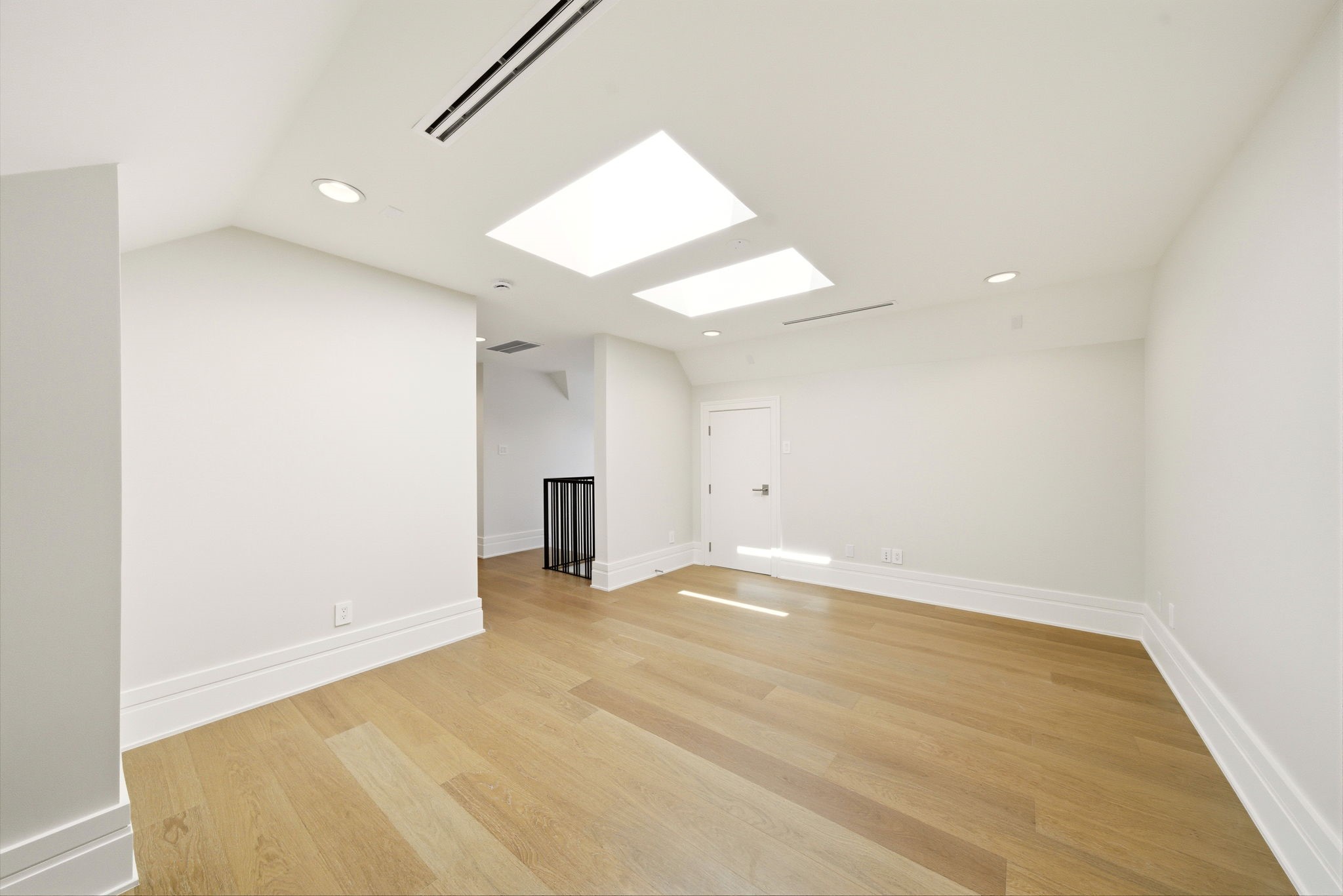 1023 Euclid Street Houston, TX 77009 - Photo 42 of 50 Multi functional game room with skylights, hardwood flooring, and endless possibilities for a media room, office, or playroom.