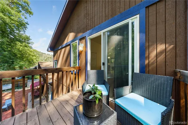 a view of a two chairs in the balcony