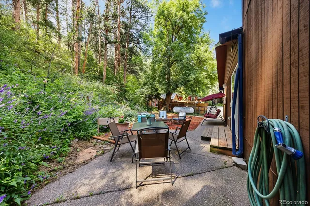 a view of a wooden house with a yard