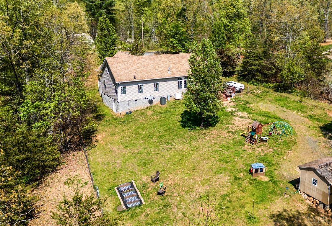 1105 East Perch Road Monroe, VA 24574 - Photo 54 of 60 a view of a house with a yard and large trees
