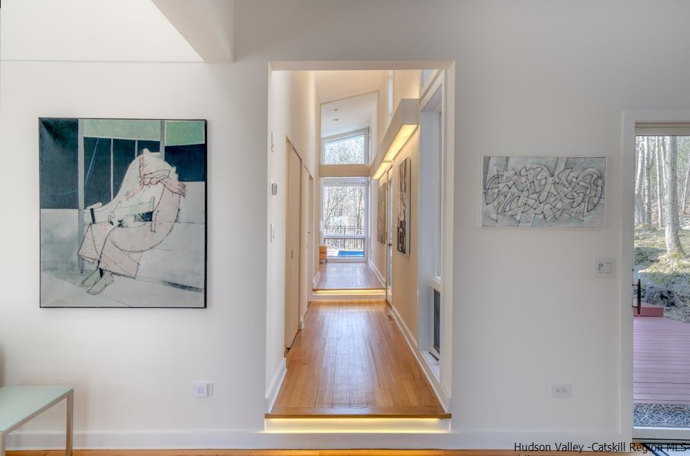373 Red Top Road Lloyd, NY 12528 - Photo 12 of 32 a view of a hallway with wooden floor and dining room view