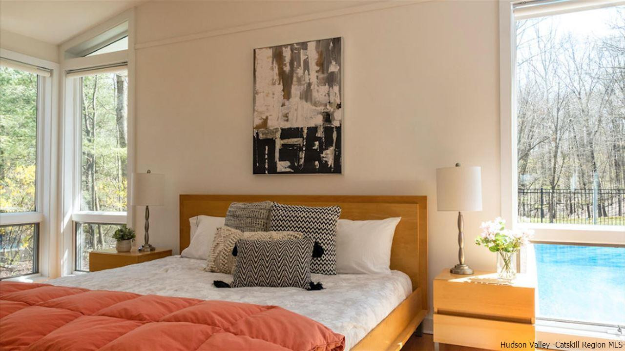 373 Red Top Road Lloyd, NY 12528 - Photo 13 of 32 a bedroom with a bed and wooden floor