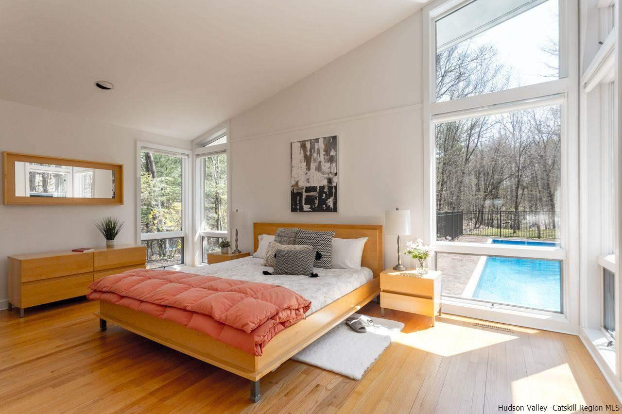 373 Red Top Road Lloyd, NY 12528 - Photo 14 of 32 a bedroom with a large bed and a window