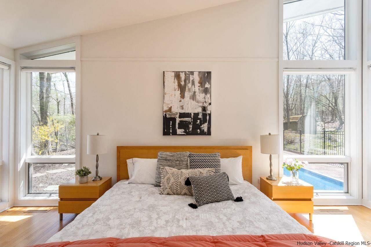 373 Red Top Road Lloyd, NY 12528 - Photo 15 of 32 a bedroom with a large bed and a large window