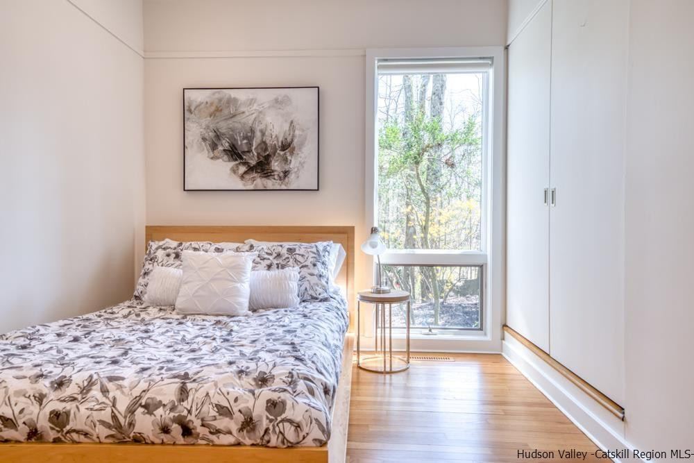 373 Red Top Road Lloyd, NY 12528 - Photo 17 of 32 a bedroom with a large bed and a window