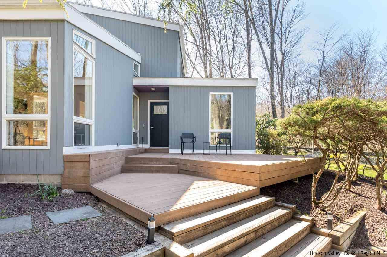 373 Red Top Road Lloyd, NY 12528 - Photo 4 of 32 a view of a house with a chairs and table in a patio