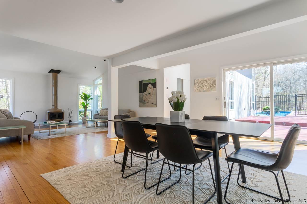 373 Red Top Road Lloyd, NY 12528 - Photo 10 of 32 a view of a dining room with furniture window and wooden floor