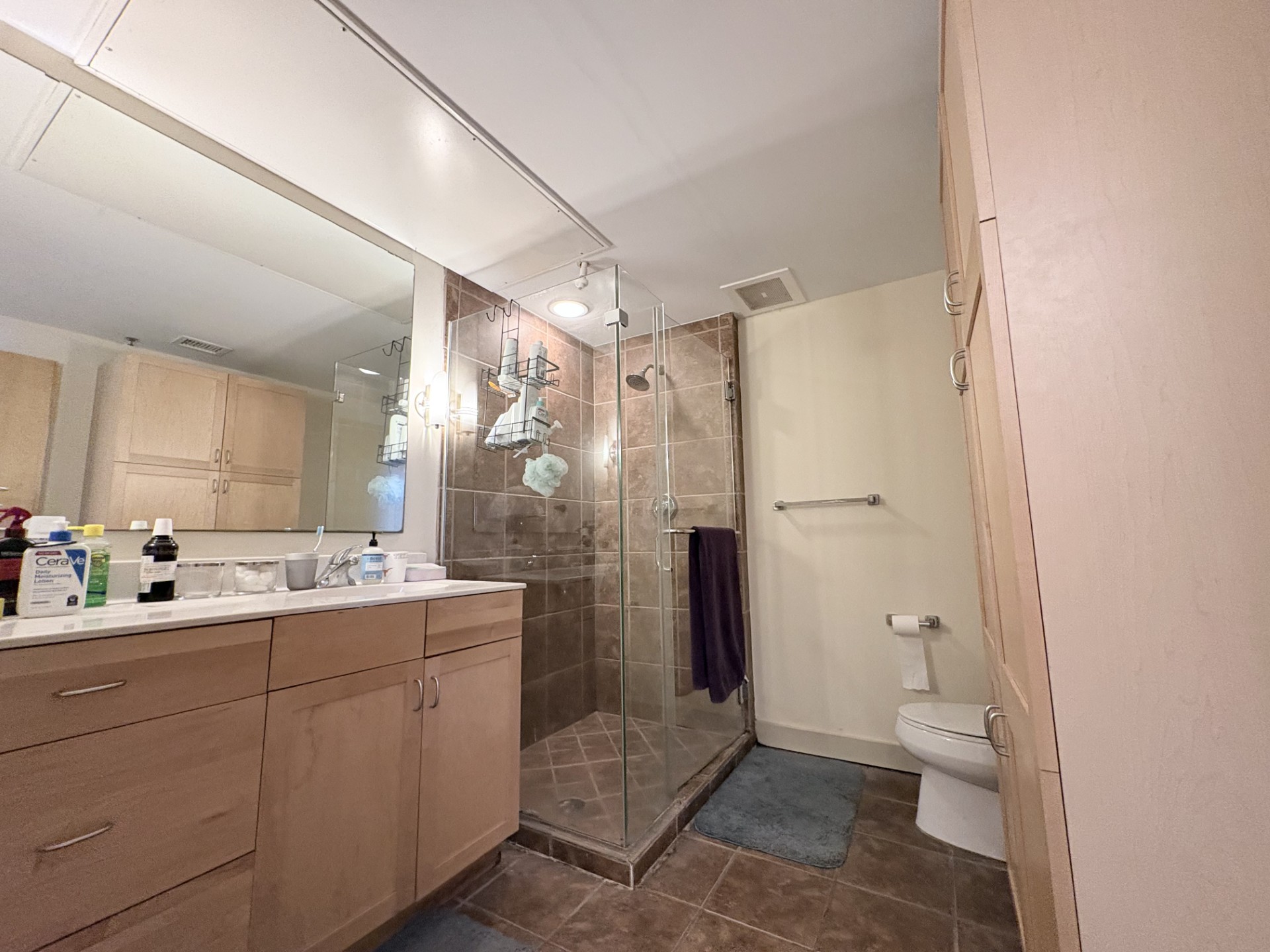 711 West 26th Street, Unit 700 Austin, TX 78705 - Photo 16 of 20 a bathroom with a double vanity sink toilet and shower