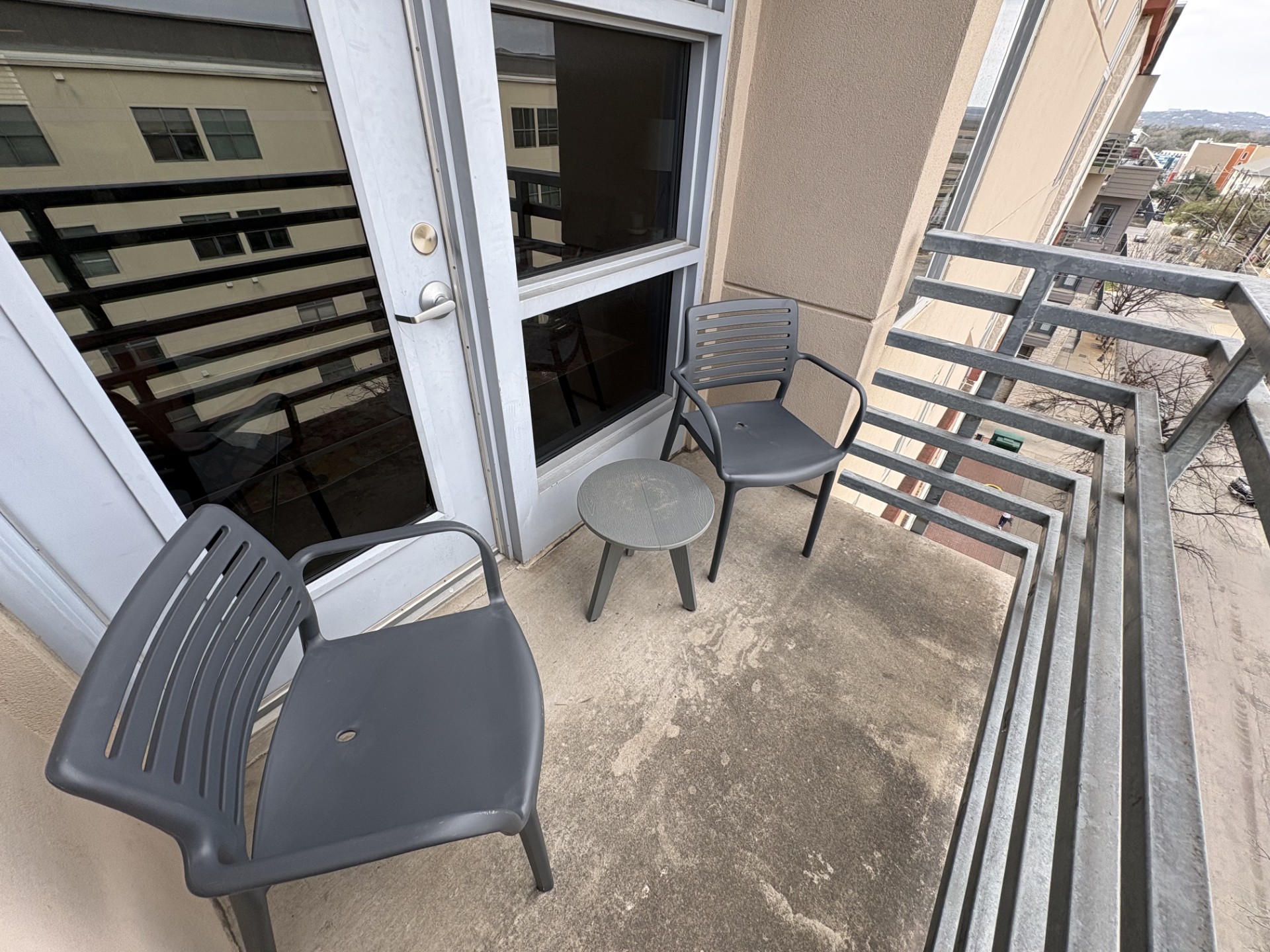 711 West 26th Street, Unit 700 Austin, TX 78705 - Photo 7 of 20 a living room with chairs and a fireplace