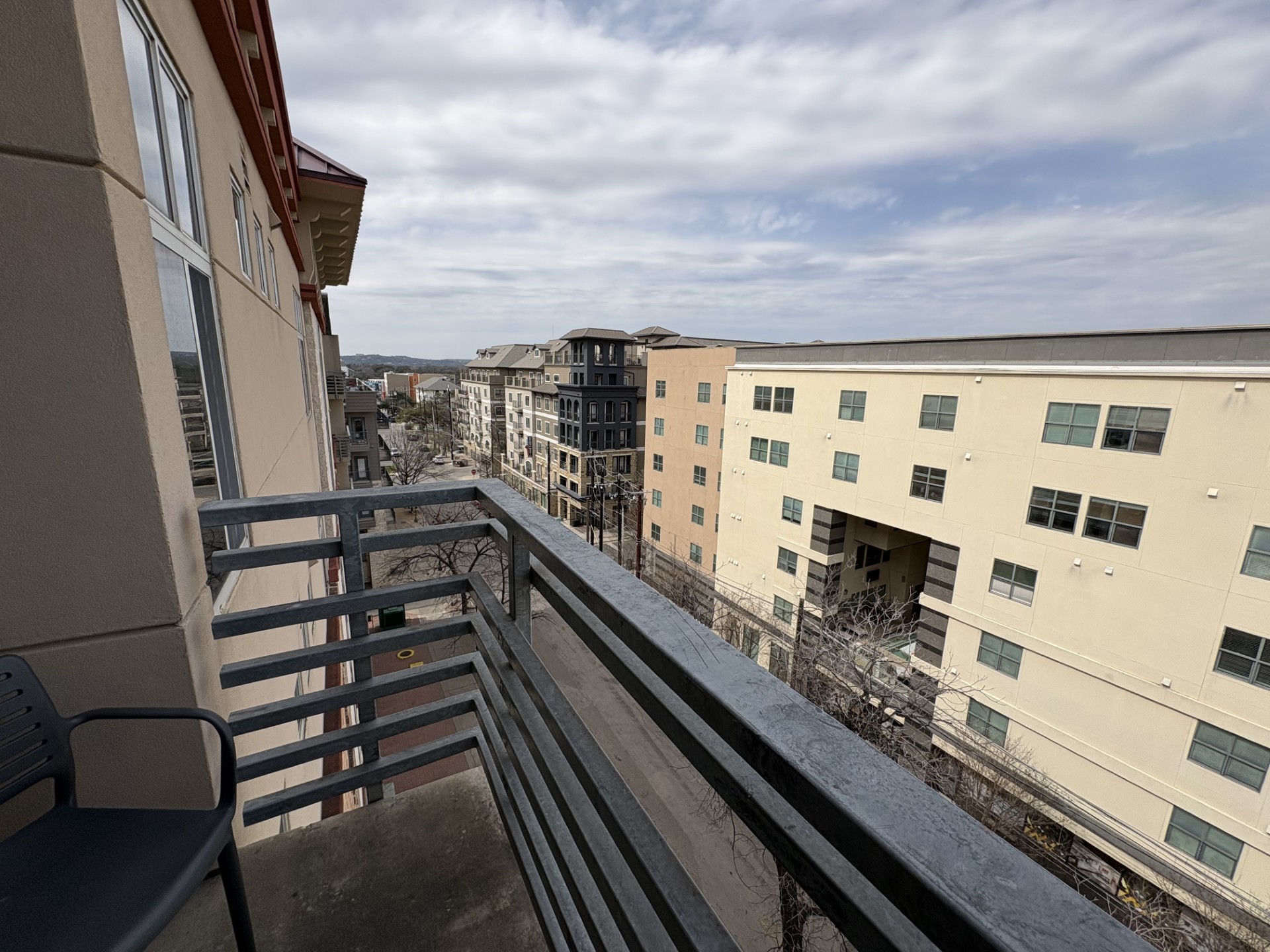 711 West 26th Street, Unit 700 Austin, TX 78705 - Photo 8 of 20 a view of balcony with wooden floor and fence