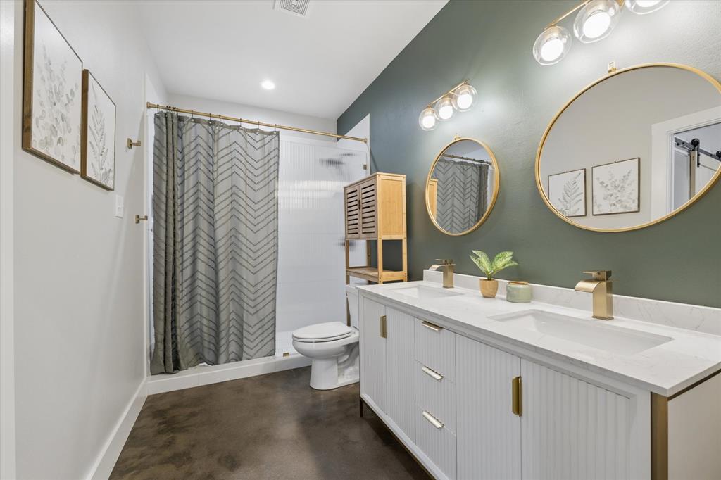 286 Benevolence Way China Spring, TX 76633 - Photo 17 of 37 Bathroom featuring a dual vanity with white cabinetry, integrated sinks, and gold-finish fixtures