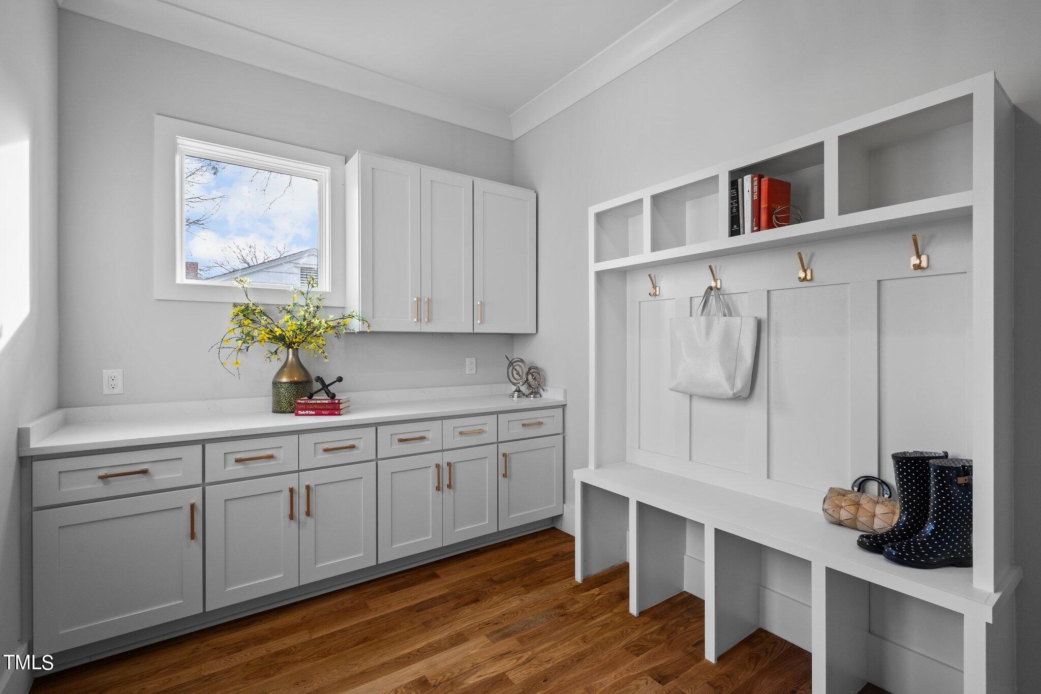 421 Harding Street Raleigh, NC 27604 - Photo 22 of 50 a kitchen with white cabinets and window